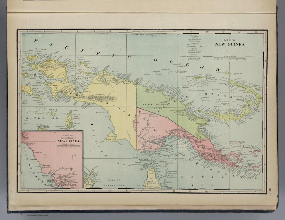 Student marks the location of New Guinea on a world map in a classroom