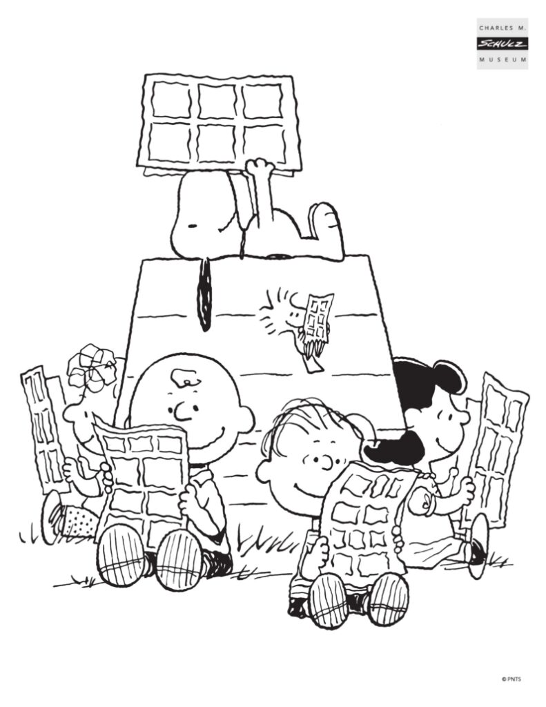 Child coloring a Charlie Brown page in travel backpack