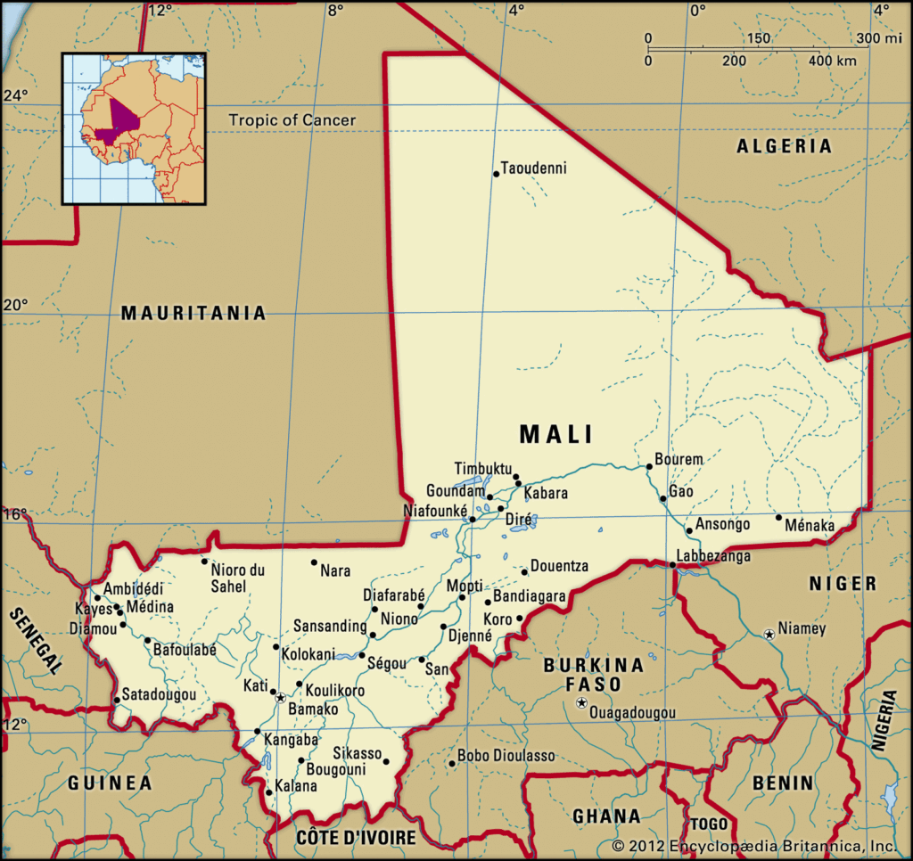 Student planning Mali route on printed map